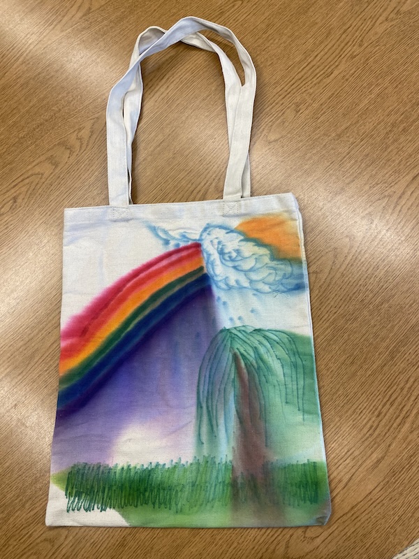 Canvas bag with a rainbow and willow tree painted on it.  