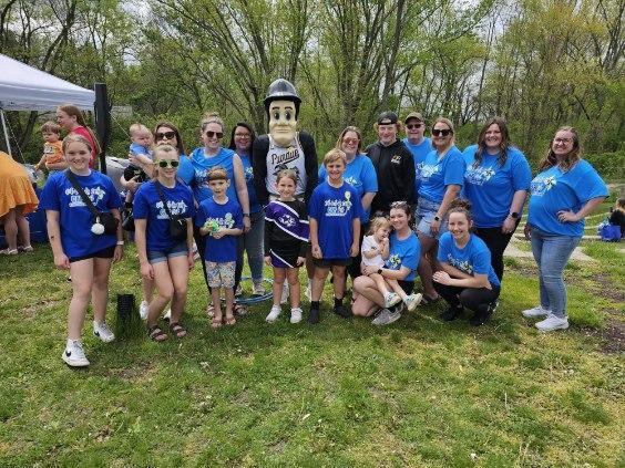 Group of volunteers with Purdue Pete in the middle from 2024